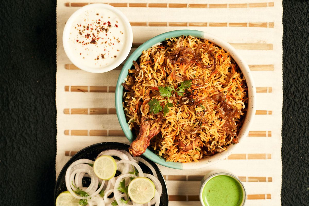 An Indian thali with several curries, rice and bread